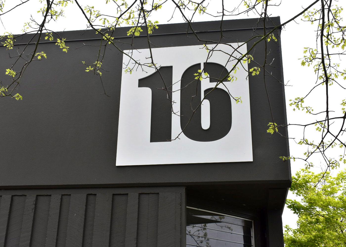 Each building received updated painted PVC panels that call out the building number.