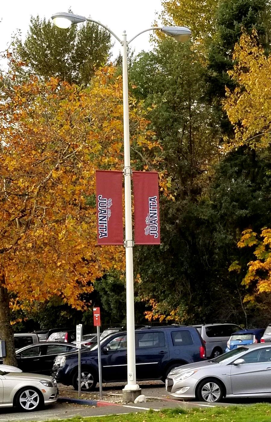 The Juanita High School sign package features a range of exterior signage needs - including pole banner hardware and printed banners.