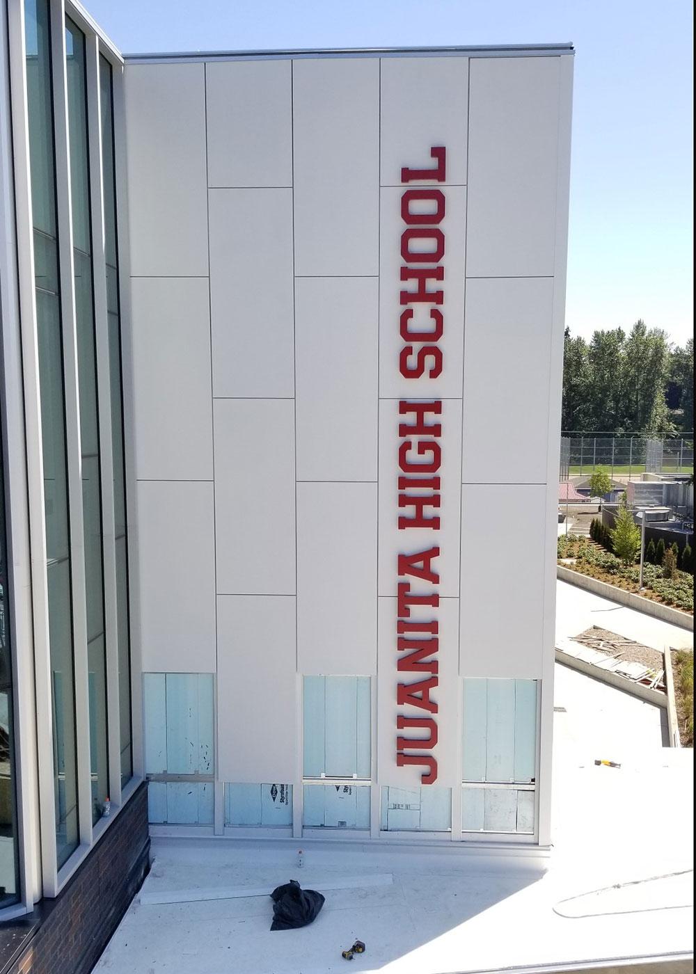 Exterior dimensional signage for Juanita High School was fabricated for this impressive entry and facade.