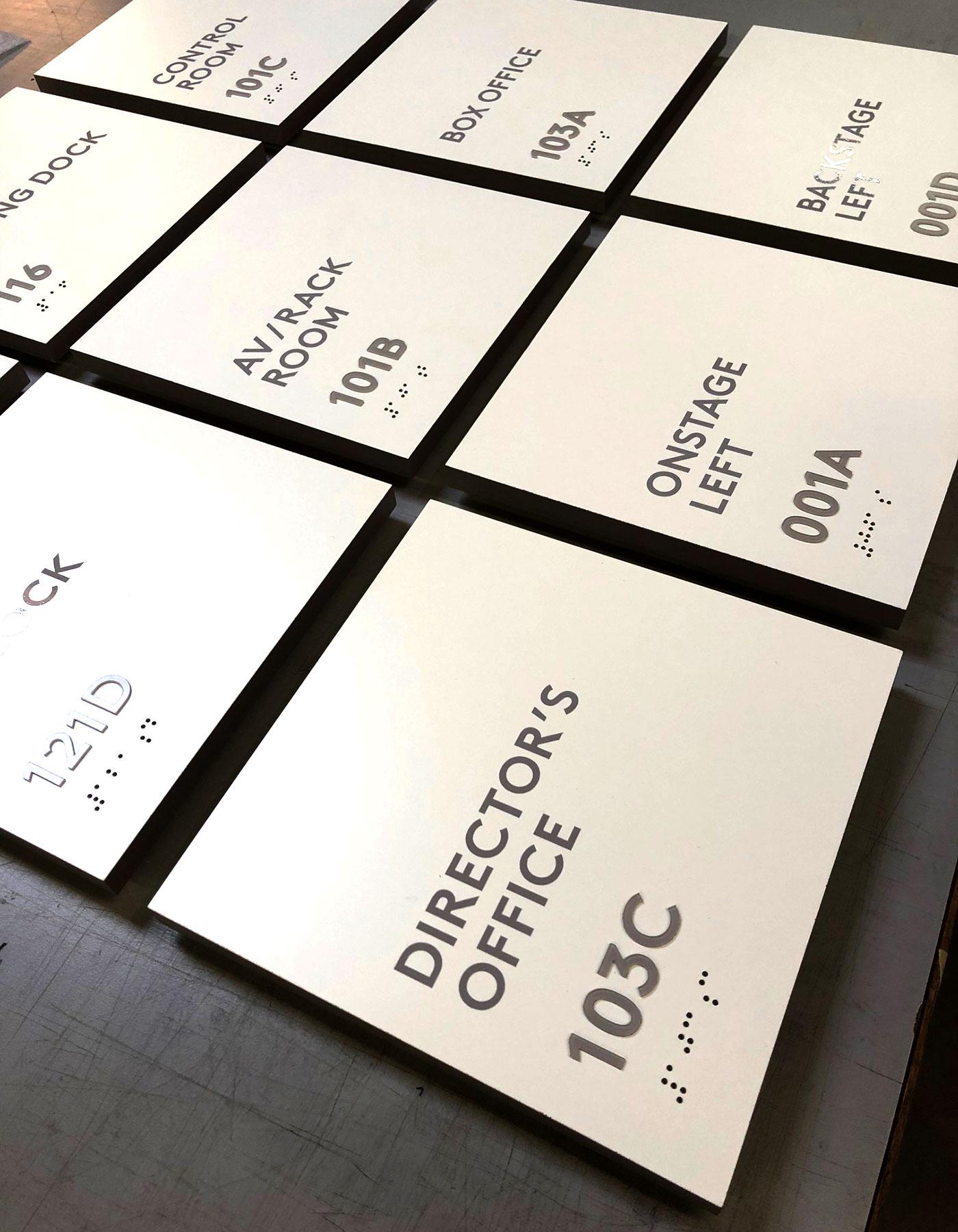 Acrylic panels will be fabricated with Clear Grade II Braille in compliance with ADA Code consistent with the overall color palette throughout the entire facility.