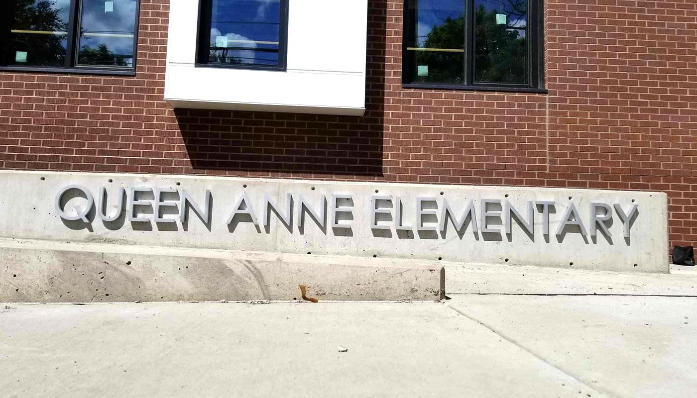 As part of the Queen Anne Elementary sign package, aluminum dimensional letters are flush mounted for exterior building ID.
