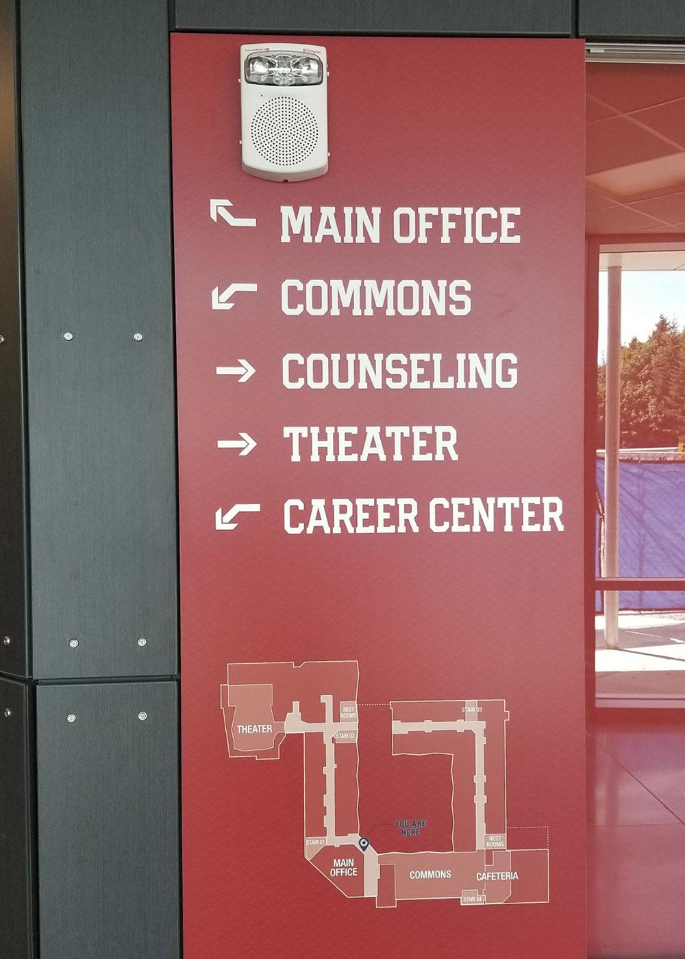 The Juanita High School sign package features a diverse range of interior signage needs - from dimensional to ADA/regulatory to flat panel wayfinding.